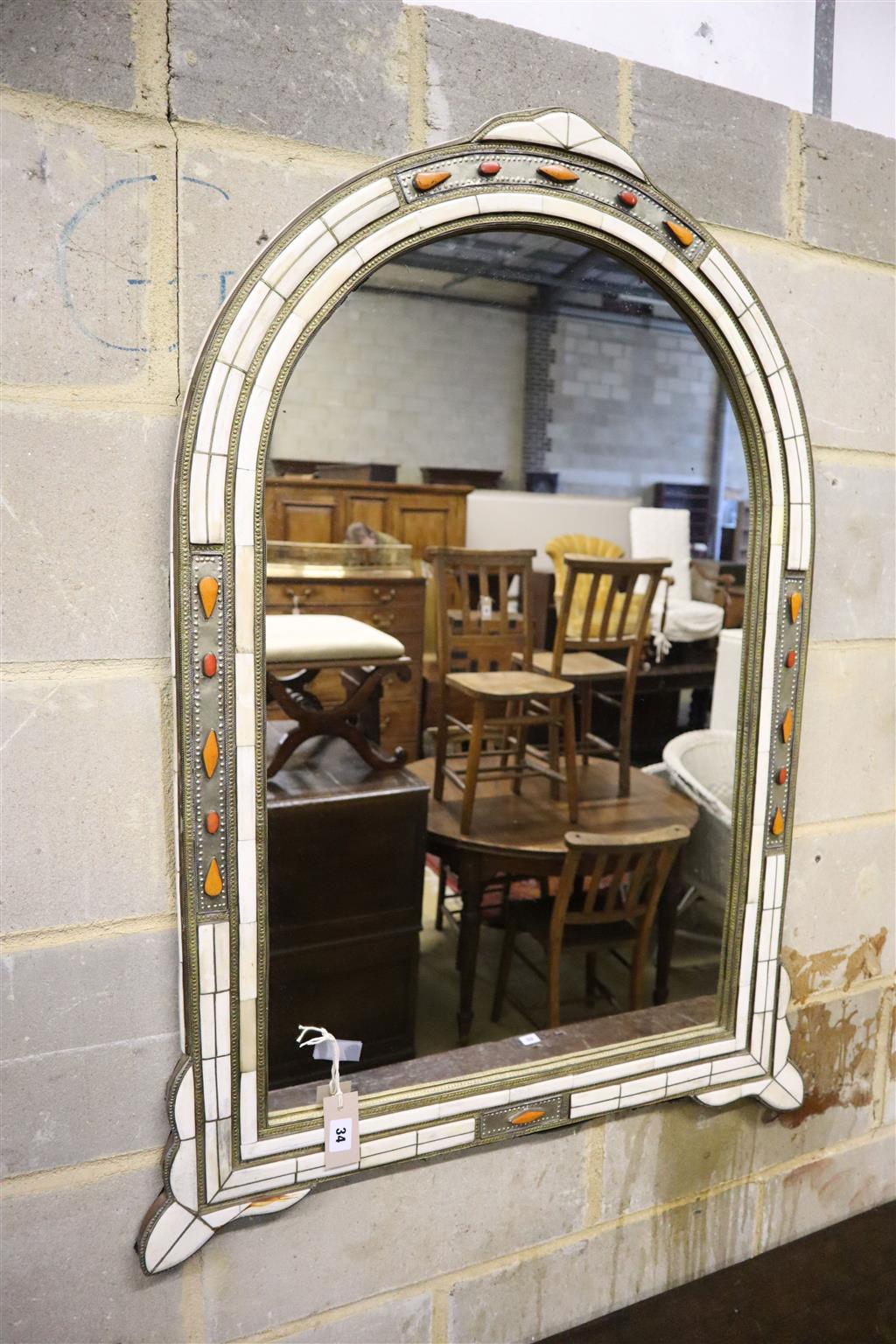 A simulated ivory wall mirror, width 80cm, height 105cm